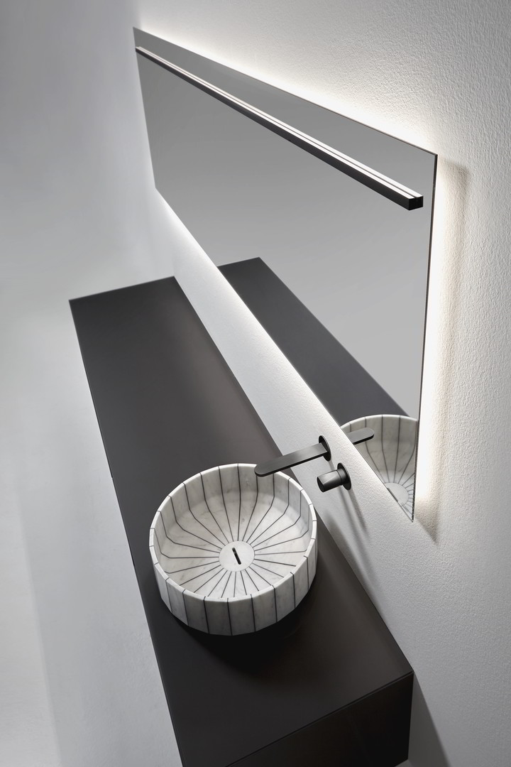 Its image is solid and statuary as that of a single block carved into the stone and polished by water.