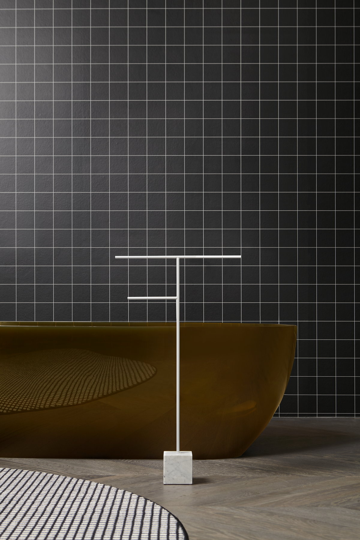 The cubic marble base refers to the precious heritage of the earth