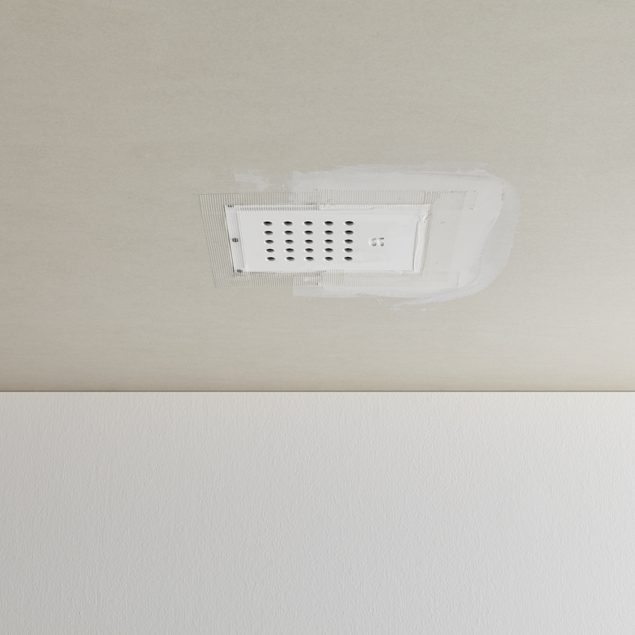 the shower head fits seamlessly with the ceiling