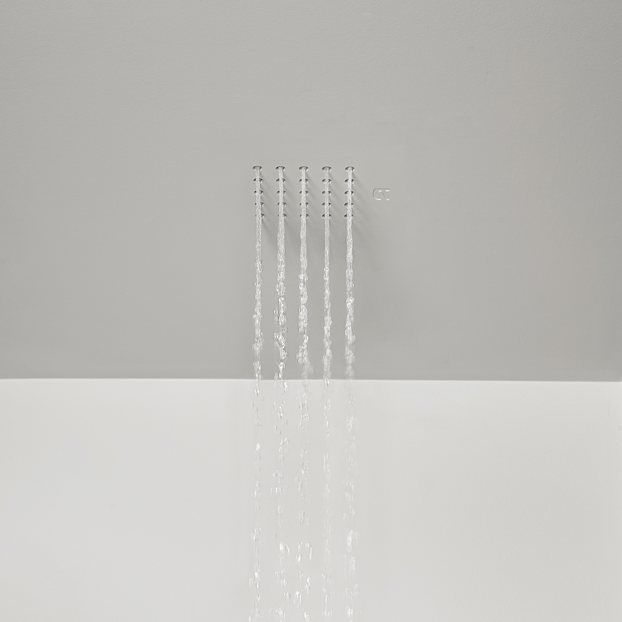 the shower head fits seamlessly with the ceiling