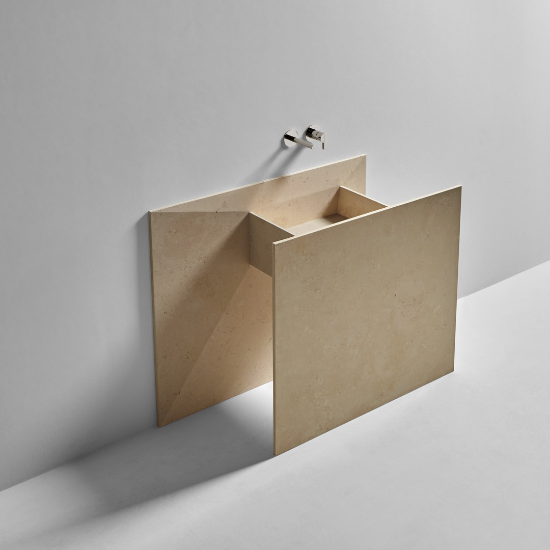 a marble origami that seems to have emerged from the wall 