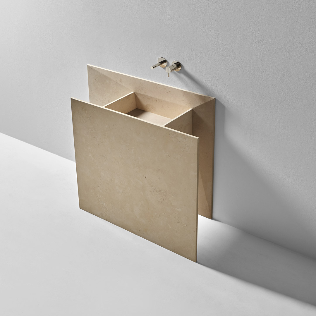 a marble origami that seems to have emerged from the wall 