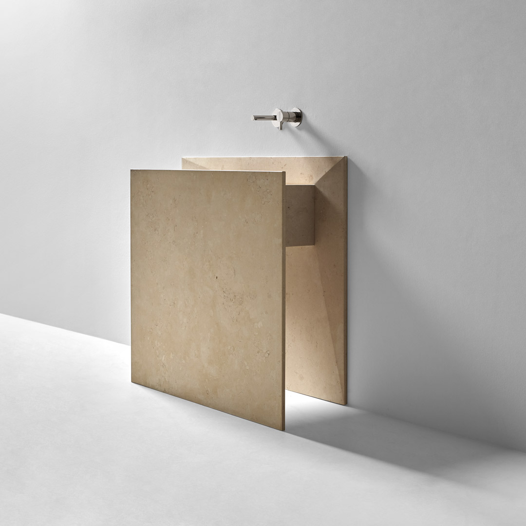 a marble origami that seems to have emerged from the wall 